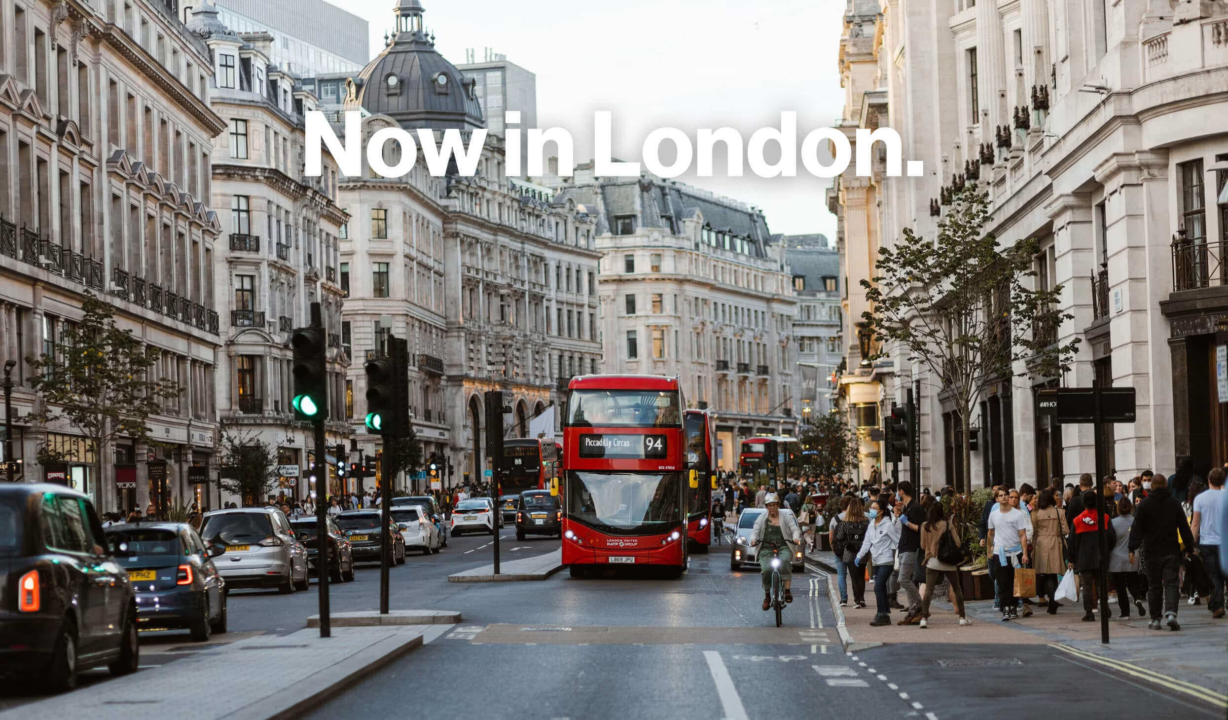 Now in London: a busy London street with a red double-decker bus